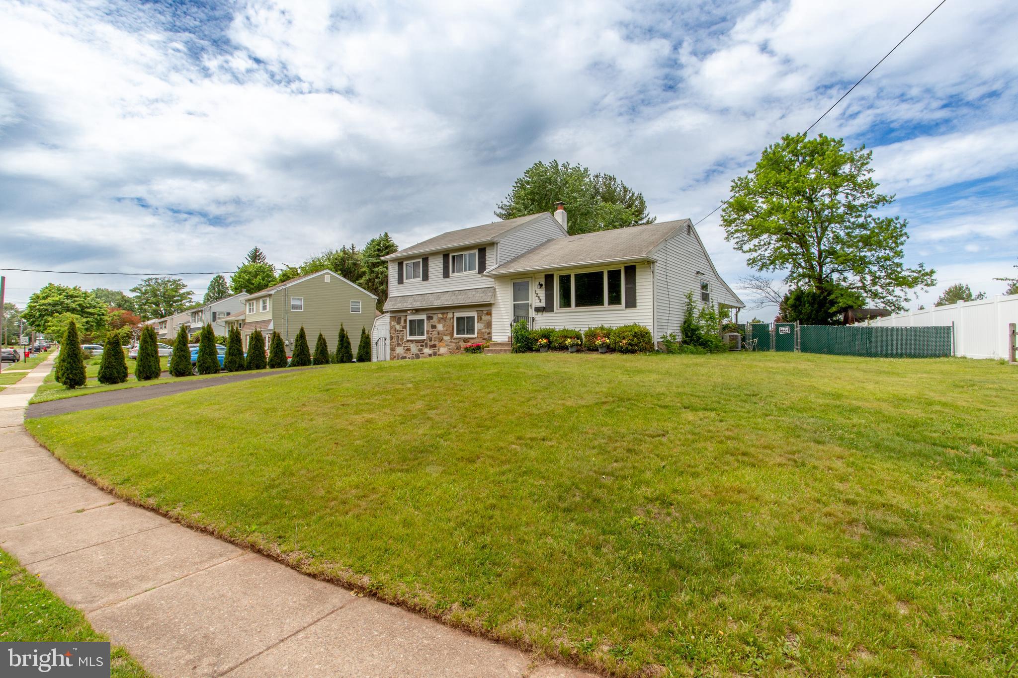 1264 Tulip Road Warminster, PA 18974 - Photo 2 of 21 a house view with swimming pool and trees in the background