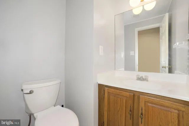 a view of a livingroom with wooden floor and a large window