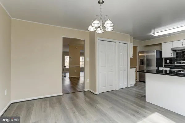 a kitchen with stainless steel appliances a stove a sink and a refrigerator