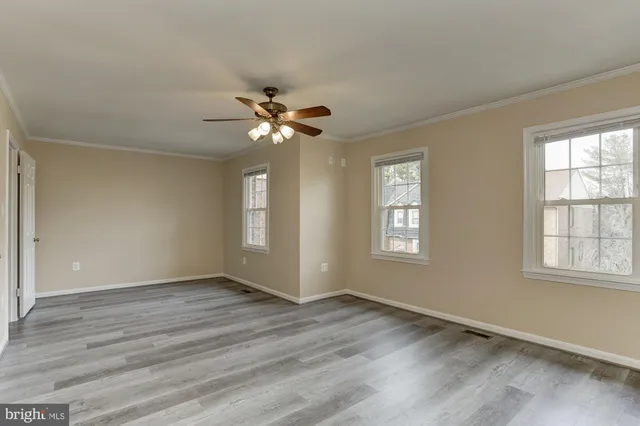 a bathroom with a bathtub shower sink and mirror