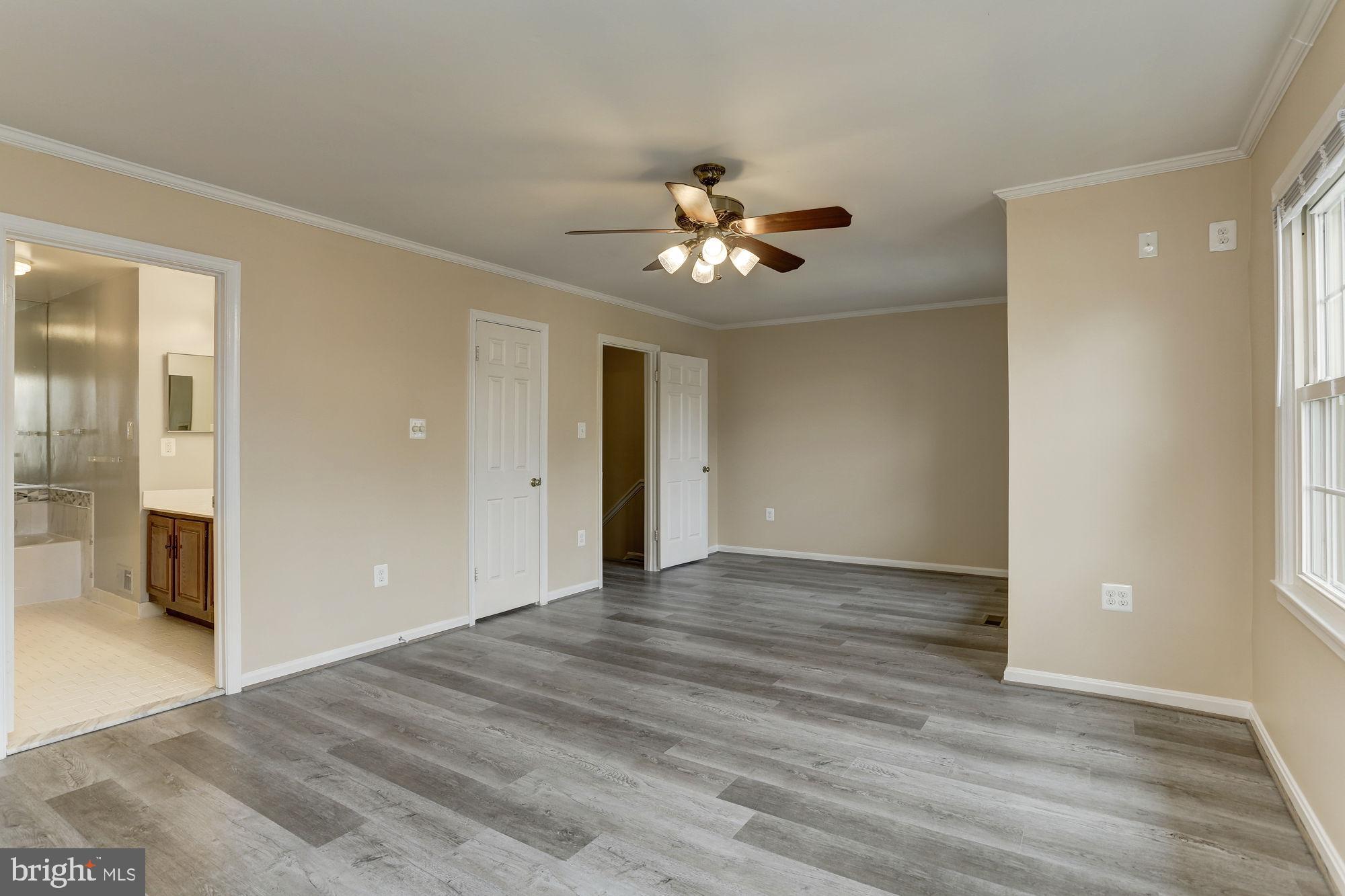 10107 Galsworthy Place Bethesda, MD 20817 - Photo 29 of 62 a view of an empty room with wooden floor