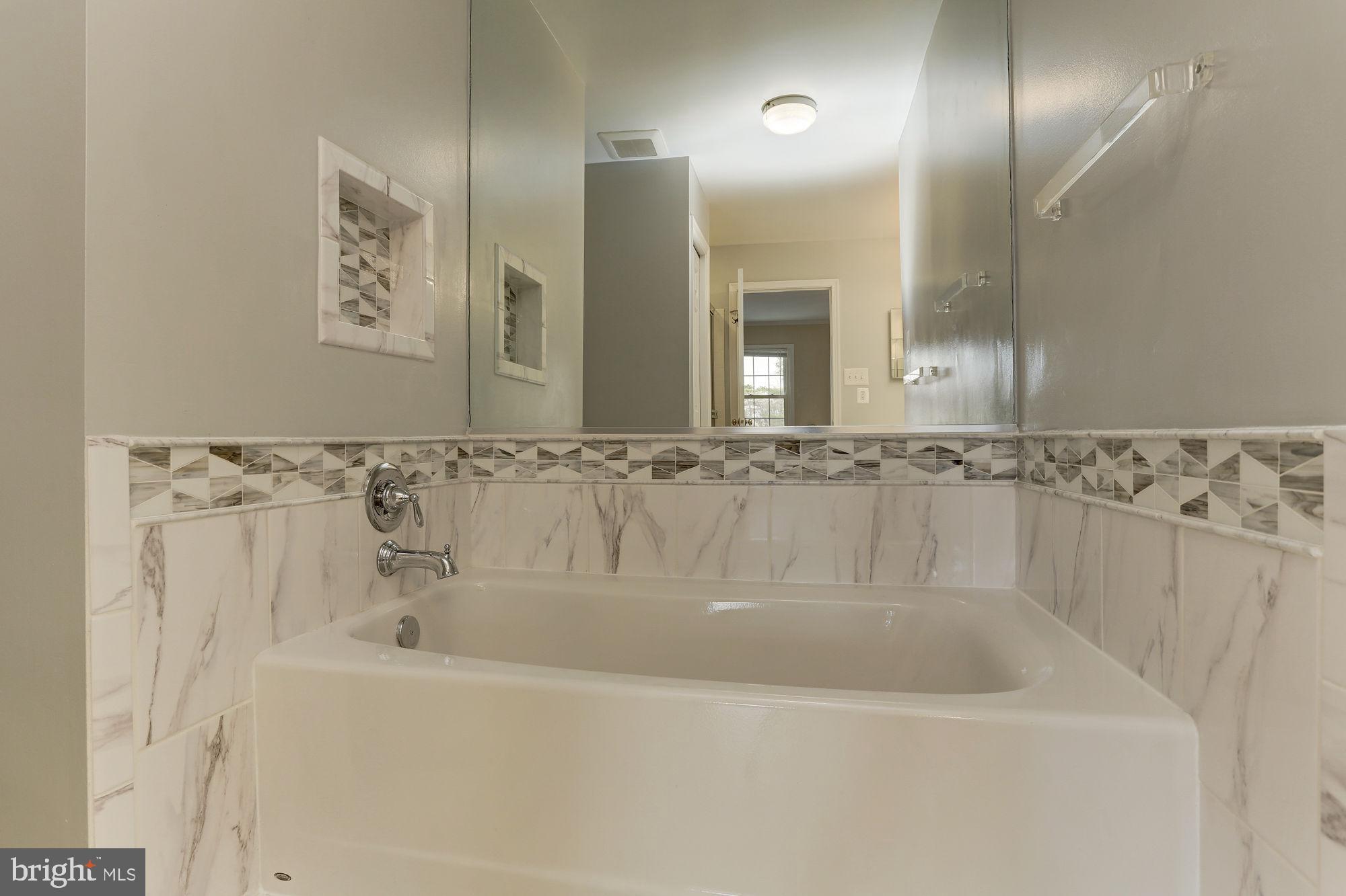 10107 Galsworthy Place Bethesda, MD 20817 - Photo 33 of 62 a close view of a bathtub in bathroom