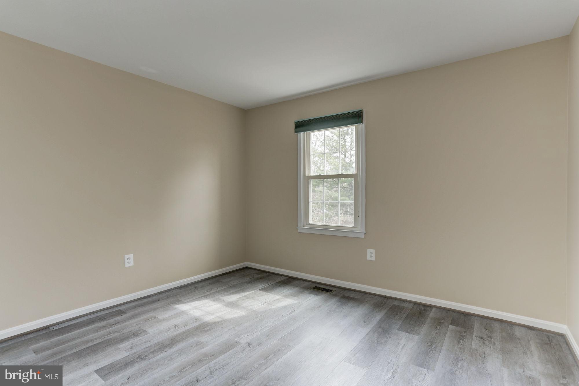 10107 Galsworthy Place Bethesda, MD 20817 - Photo 38 of 62 an empty room with a window