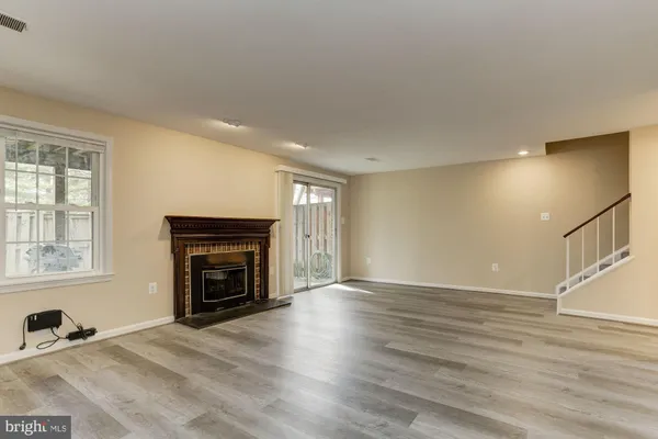 a view of balcony with wooden floor and fence