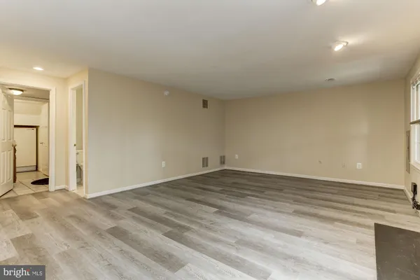a view of a porch with a table and chairs