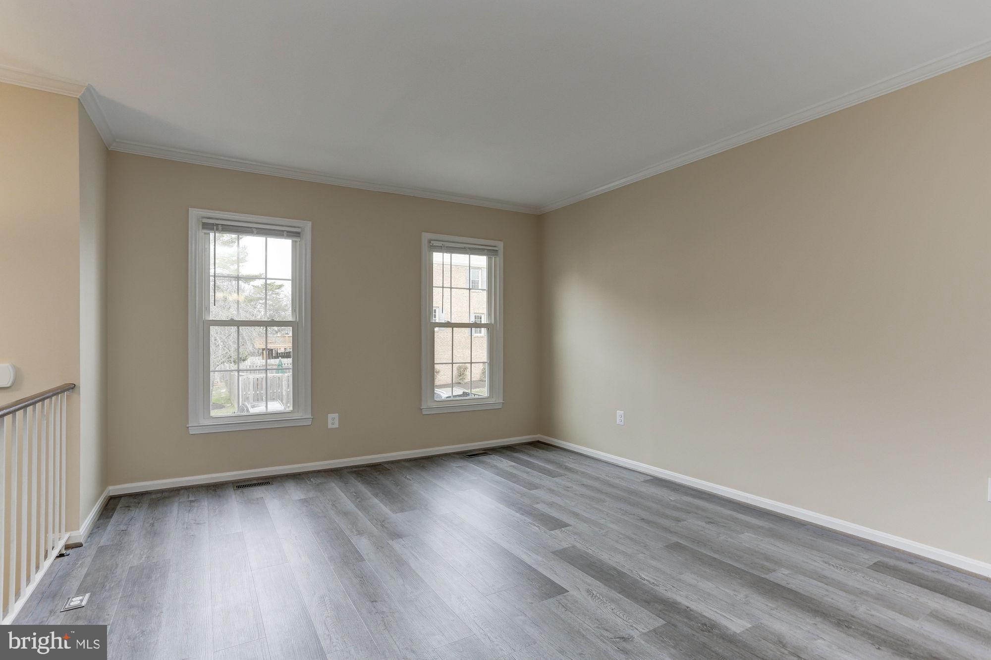 10107 Galsworthy Place Bethesda, MD 20817 - Photo 5 of 62 an empty room with wooden floor and window