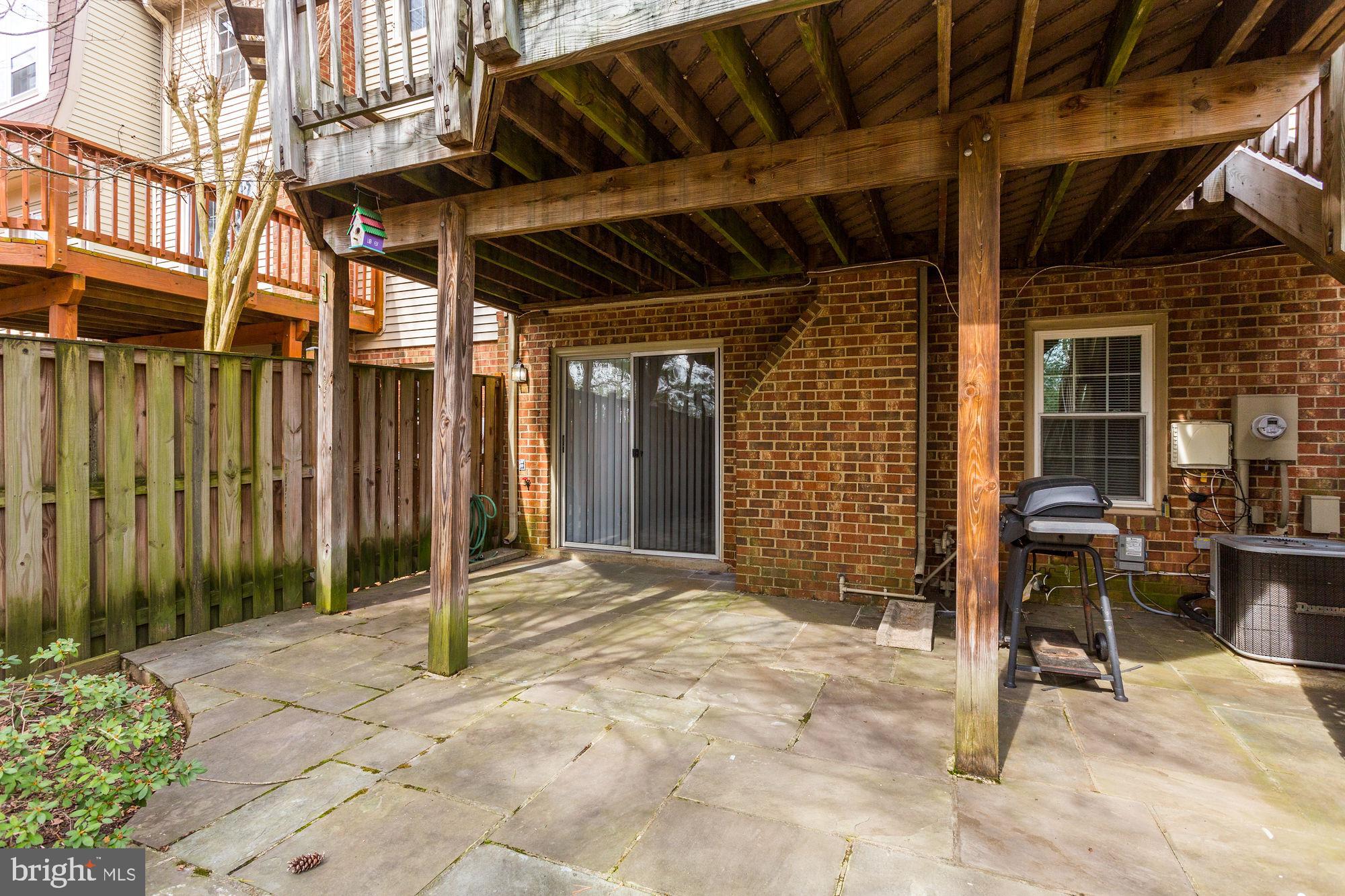 10107 Galsworthy Place Bethesda, MD 20817 - Photo 57 of 62 a view of a backyard with a patio