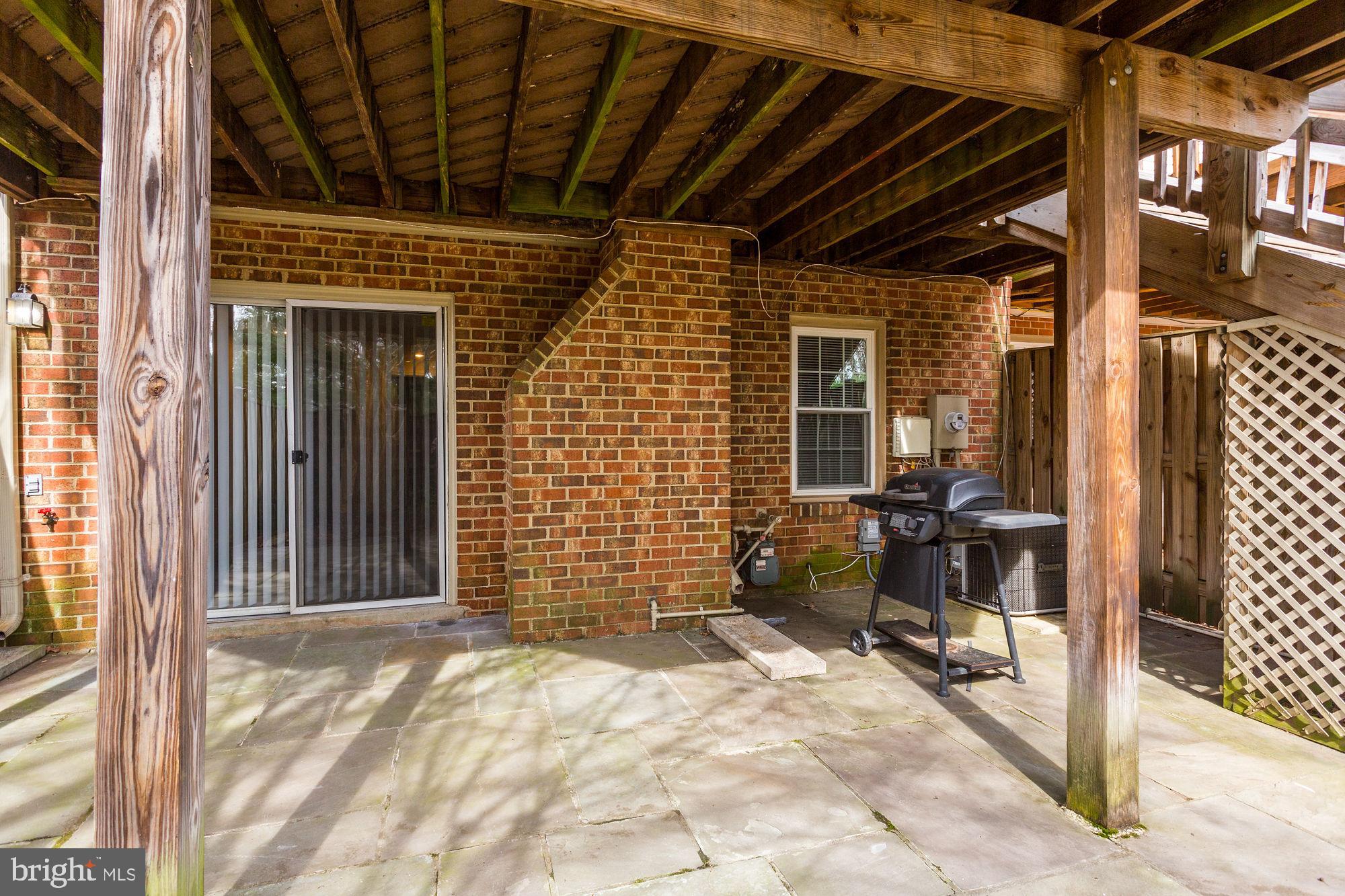 10107 Galsworthy Place Bethesda, MD 20817 - Photo 58 of 62 a view of a porch with a table and chairs