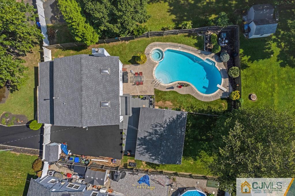 10 Crescent Road Edison, NJ 08817 - Photo 1 of 33 an aerial view of a house with a swimming pool patio and outdoor seating