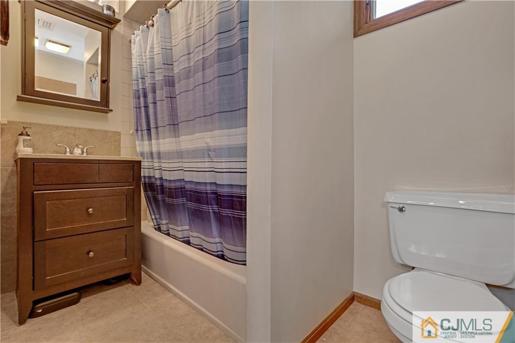10 Crescent Road Edison, NJ 08817 - Photo 19 of 33 a bathroom with a toilet and a shower