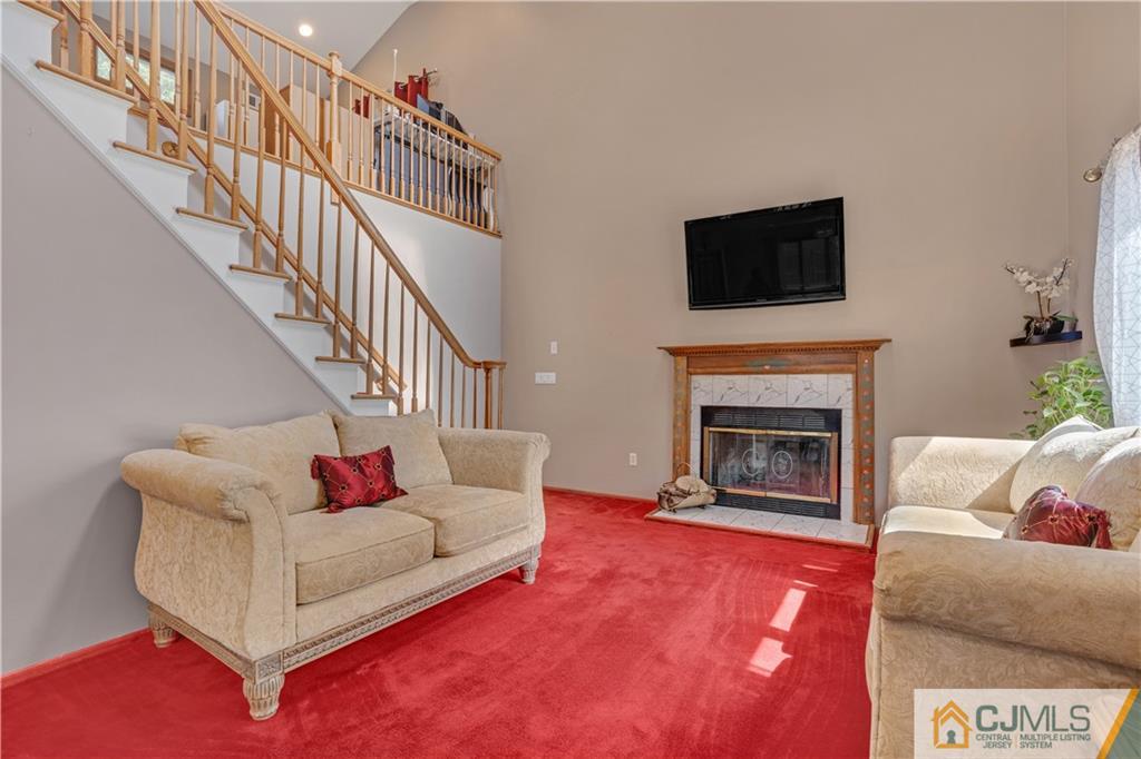 10 Crescent Road Edison, NJ 08817 - Photo 20 of 33 a living room with furniture and a fireplace