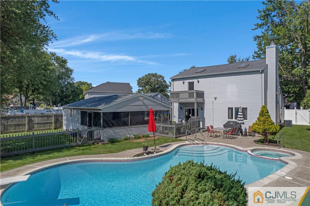 10 Crescent Road Edison, NJ 08817 - Photo 2 of 33 a view of a swimming pool with a patio