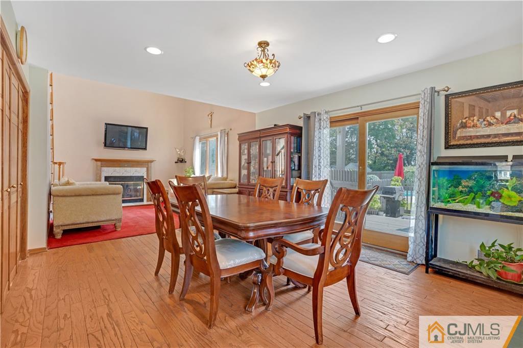 10 Crescent Road Edison, NJ 08817 - Photo 10 of 33 a dining room with furniture potted plants and wooden floor