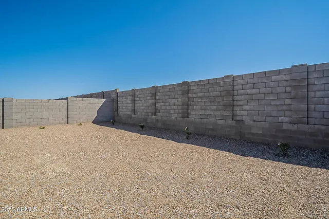 a view of outdoor space and has wooden fence