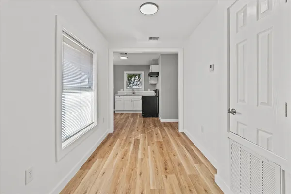 a view of a bedroom from a hallway