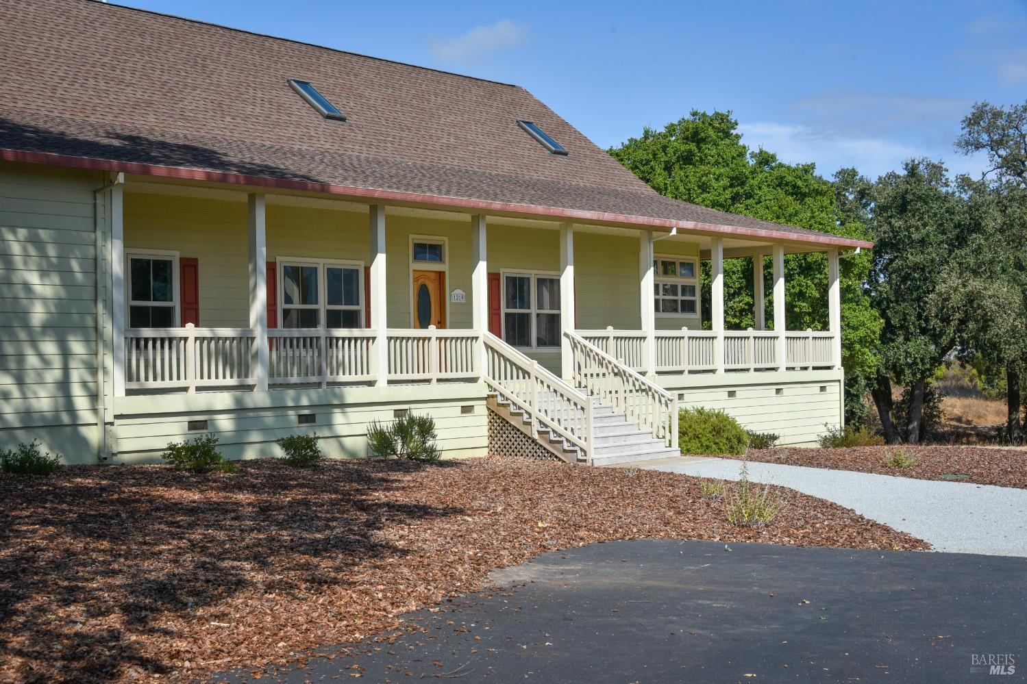 1219 Repetto Ranch Road Sonoma, CA 95476 - Photo 2 of 54 a front view of a house with a yard