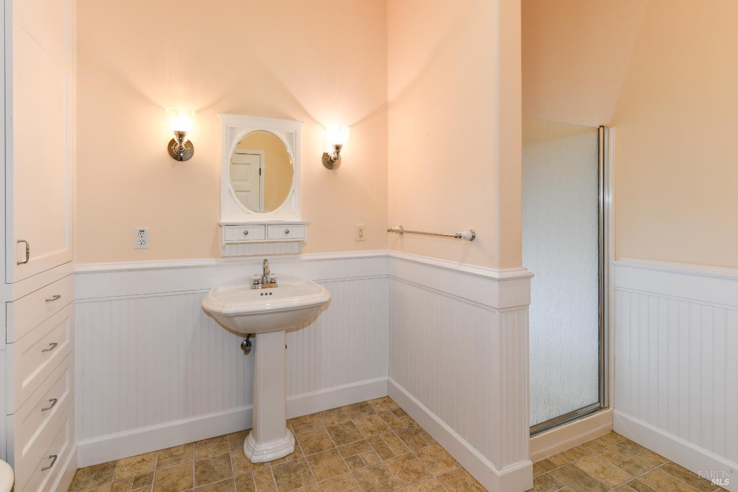 1219 Repetto Ranch Road Sonoma, CA 95476 - Photo 24 of 54 a bathroom with a sink and a mirror
