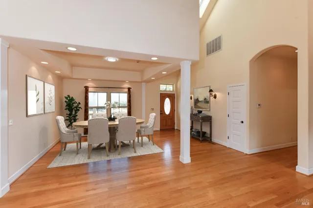a view of a dining room with furniture window and wooden floor