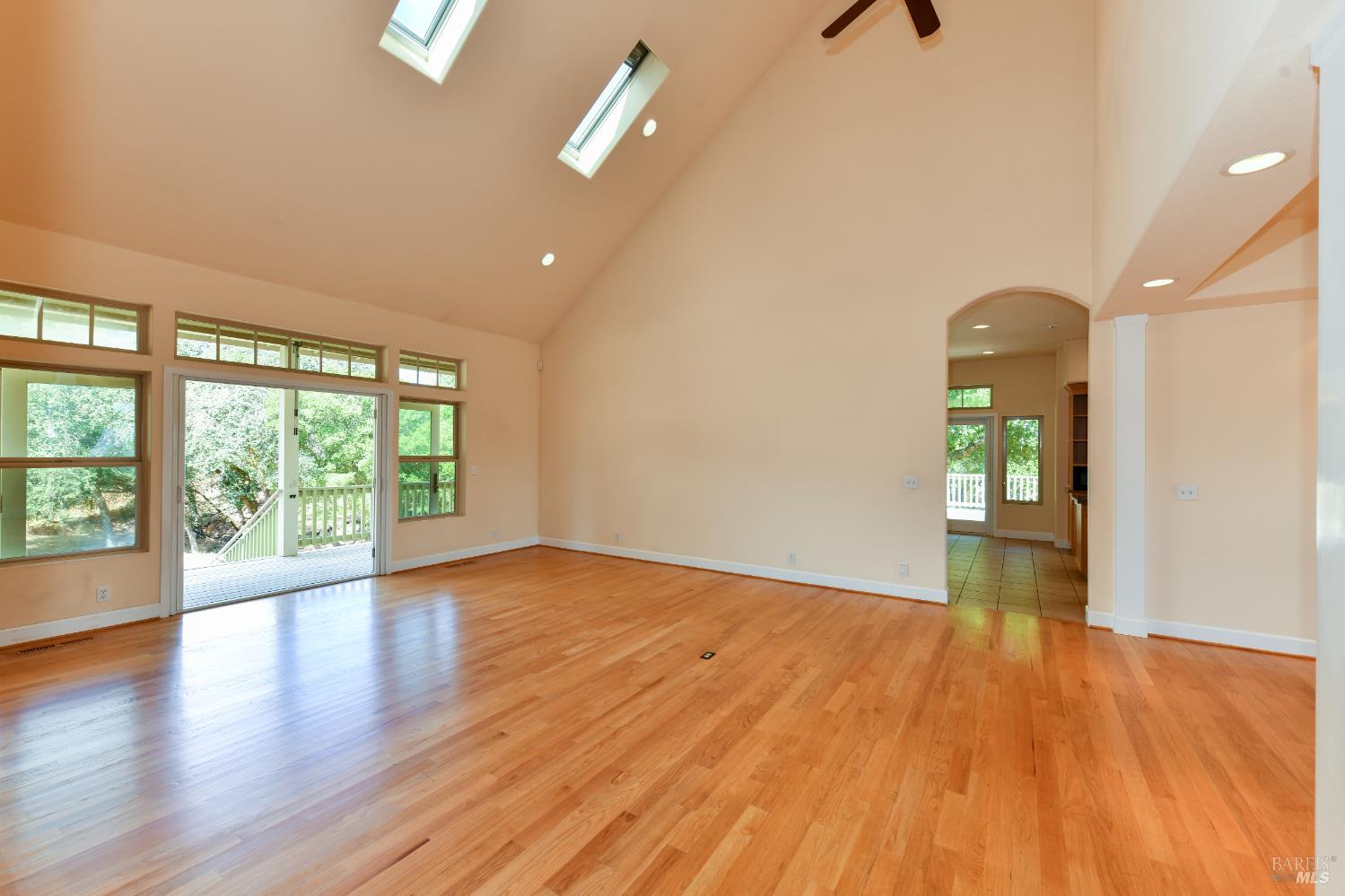 1219 Repetto Ranch Road Sonoma, CA 95476 - Photo 8 of 54 an empty room with wooden floor and windows