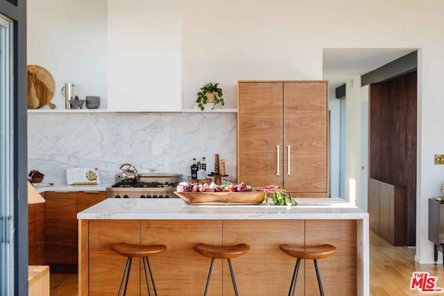 a kitchen with a table and chairs in it