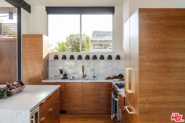 a bathroom with a sink a mirror and a bathtub