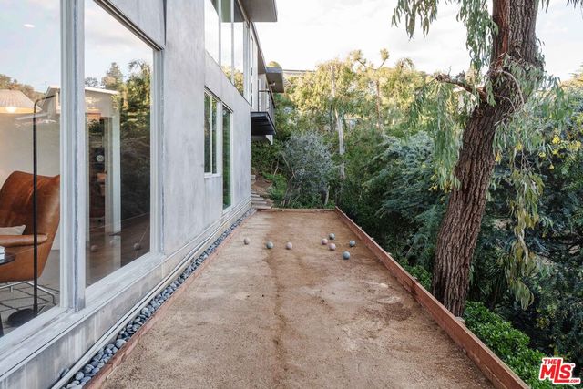 a view of a pathway both side of house