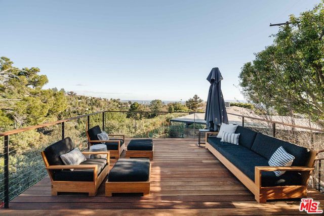 a outdoor living space with furniture and city view