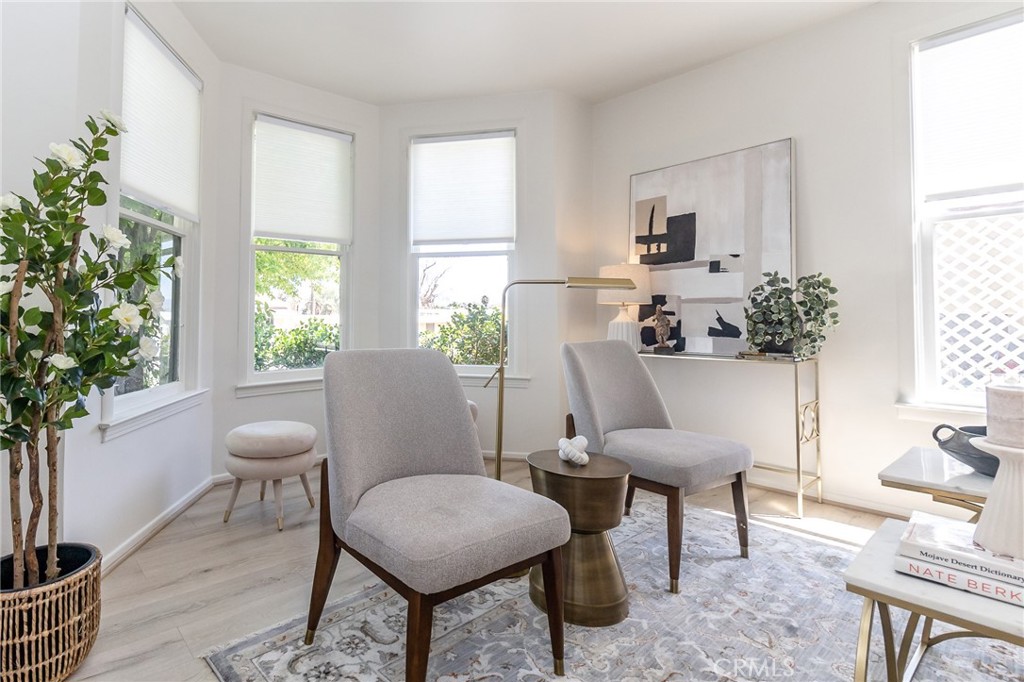 411 Bazoobuth Street Needles, CA 92363 - Photo 23 of 71 a view of a dining room with furniture and a potted plant