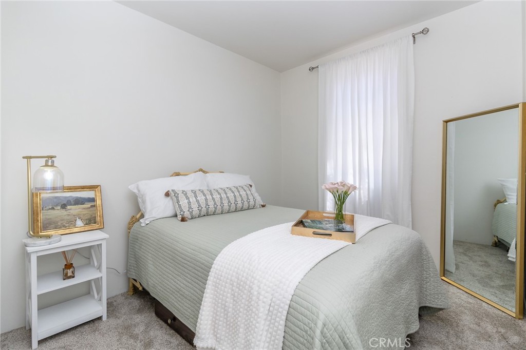 411 Bazoobuth Street Needles, CA 92363 - Photo 27 of 71 a bedroom with a bed and a window