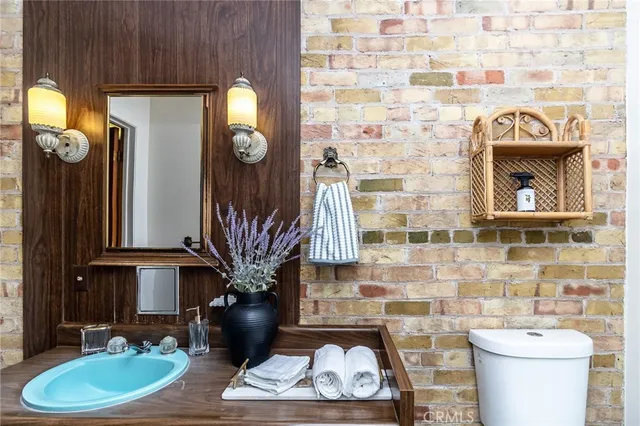 a room with furniture and a potted plant