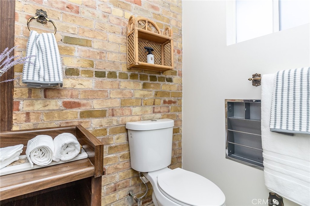 411 Bazoobuth Street Needles, CA 92363 - Photo 33 of 71 a bathroom with a toilet and a sink