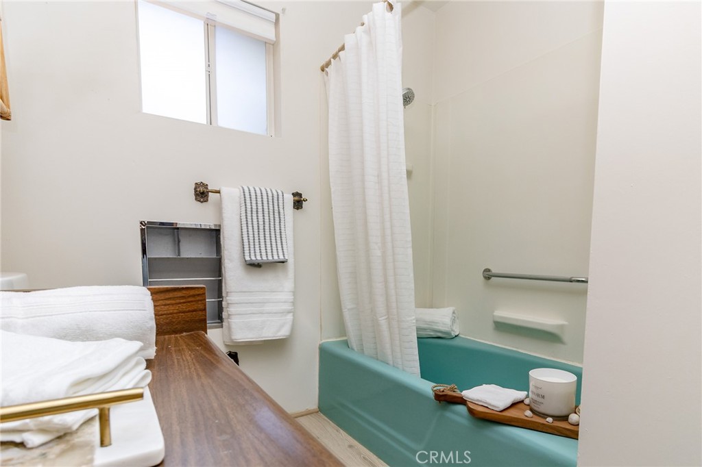 411 Bazoobuth Street Needles, CA 92363 - Photo 34 of 71 a bathroom with a sink and a mirror