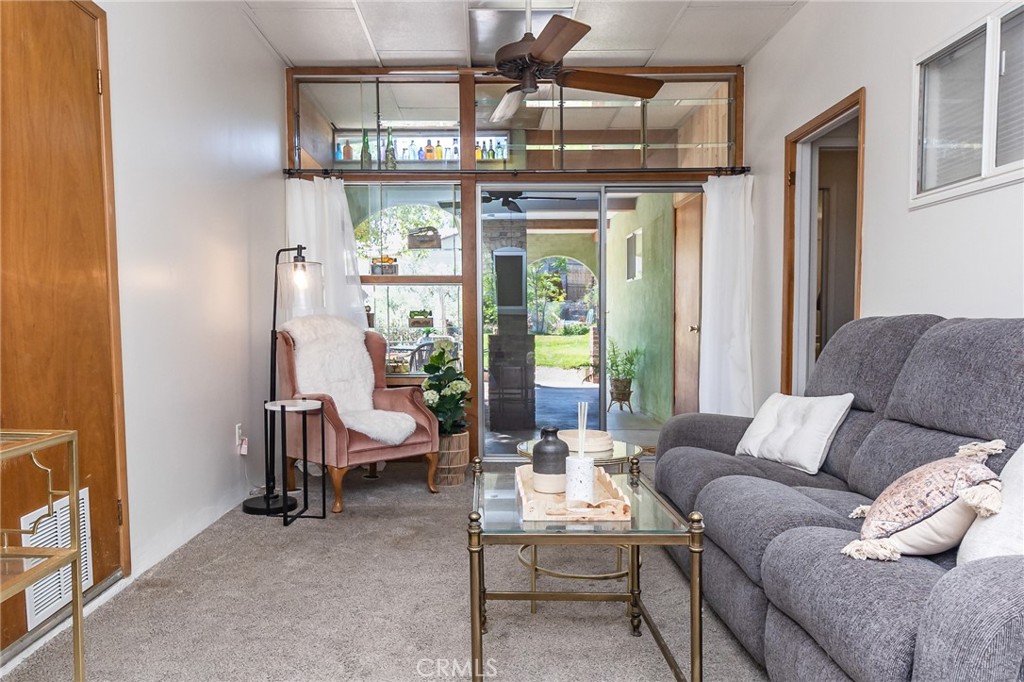 411 Bazoobuth Street Needles, CA 92363 - Photo 42 of 71 a living room with furniture and a large window