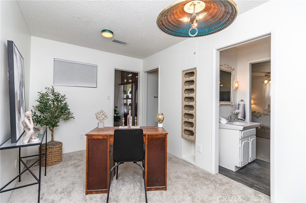 411 Bazoobuth Street Needles, CA 92363 - Photo 52 of 71 a view of a workspace with furniture