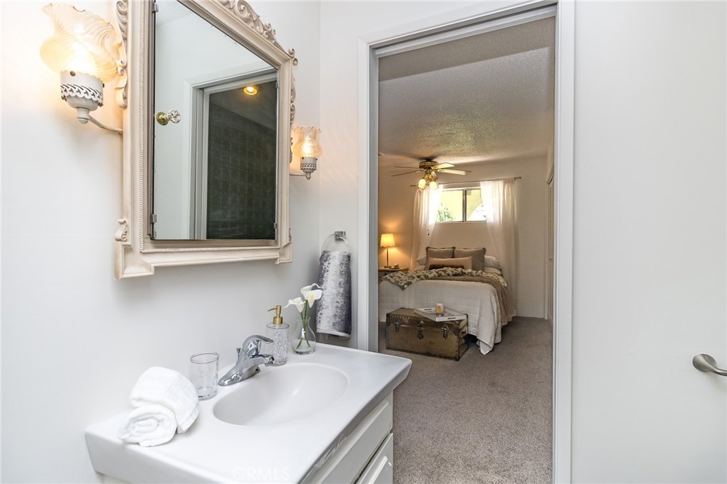 411 Bazoobuth Street Needles, CA 92363 - Photo 53 of 71 a bathroom with a sink and a mirror