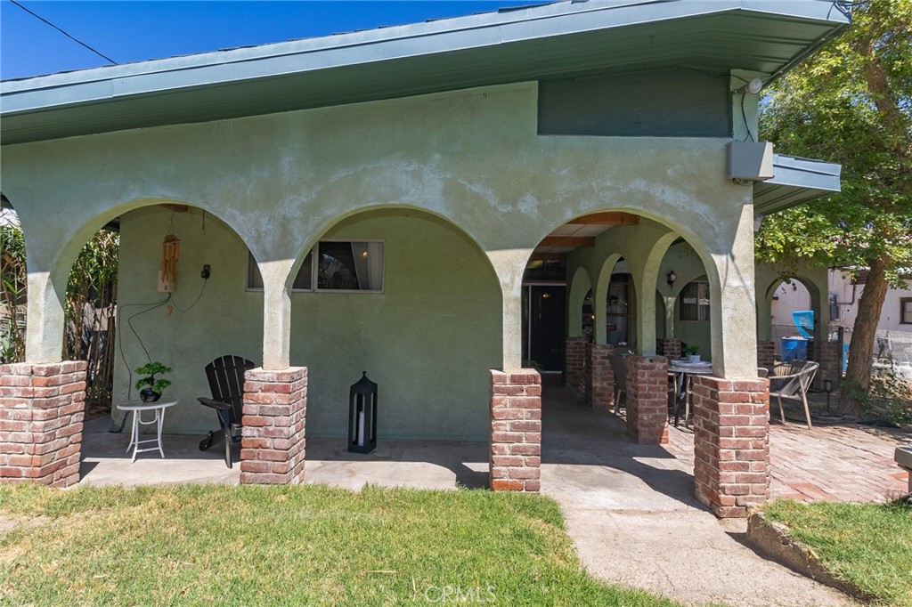 411 Bazoobuth Street Needles, CA 92363 - Photo 64 of 71 a front view of a house with garden