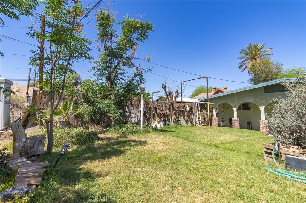 411 Bazoobuth Street Needles, CA 92363 - Photo 67 of 71 a view of a yard in front of house