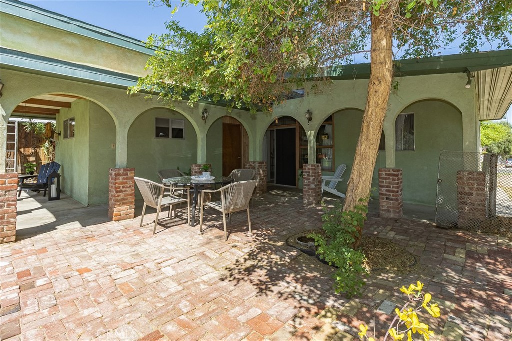 411 Bazoobuth Street Needles, CA 92363 - Photo 68 of 71 a view of a entrance gate of the house with outdoor seating