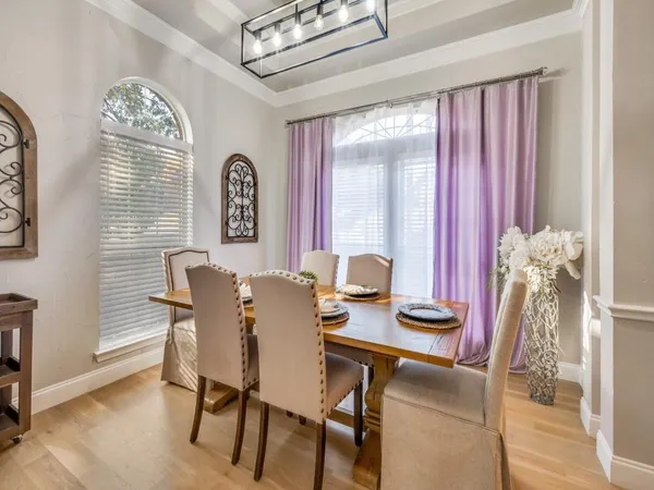 a view of a dining room with furniture and a window