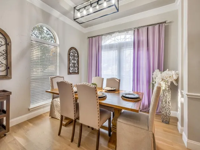 a view of a dining room with furniture and a window