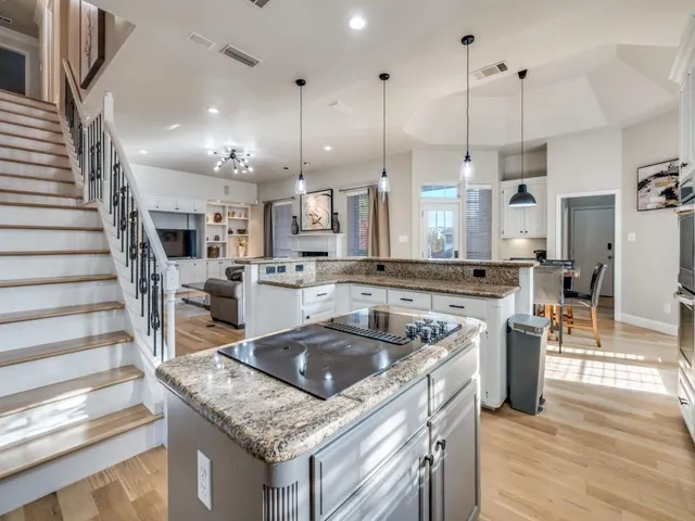 a kitchen that has a lot of cabinets in it