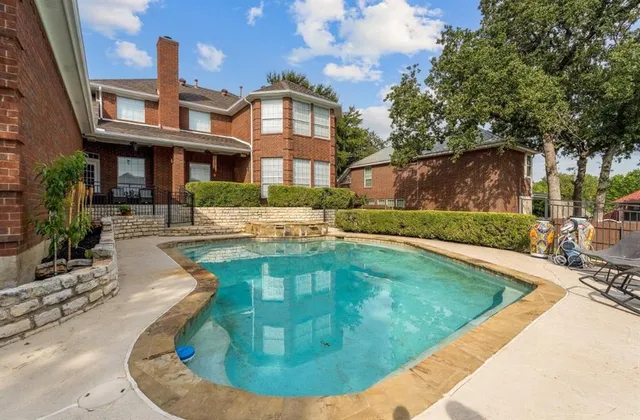 a view of a house with swimming pool