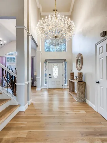 a view of an entryway with wooden floor