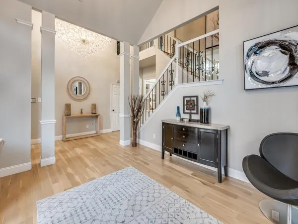 a living room with furniture and a clock