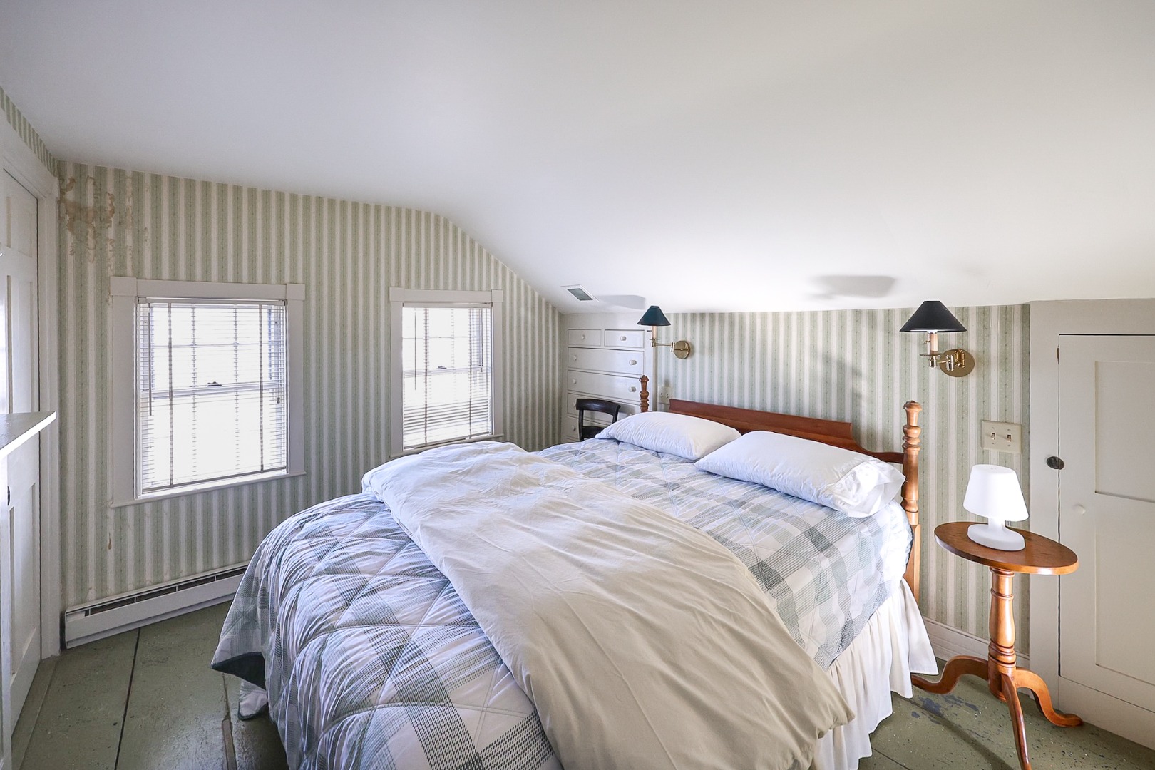 1 Beaver Street Nantucket, MA 02554 - Photo 20 of 28 a bed sitting in a spacious bedroom next to a window