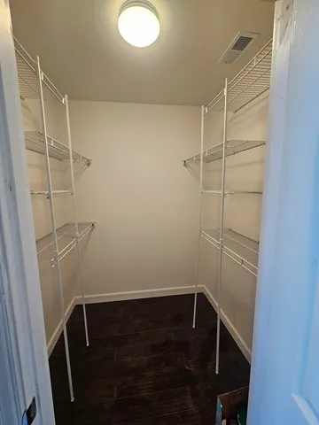 a view of storage and utility room with empty racks