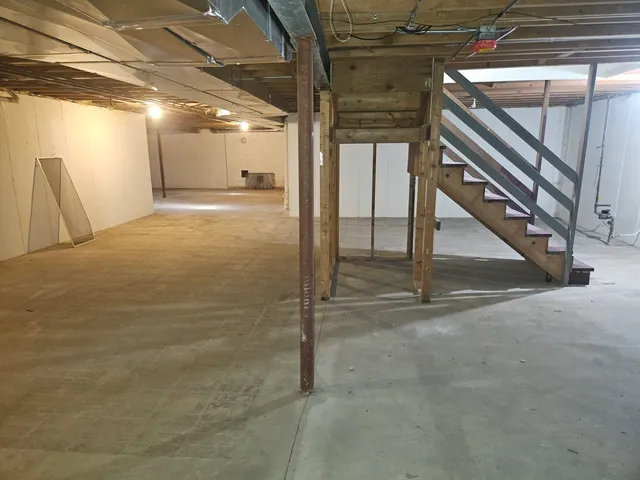 a view of a room with rack and white walls