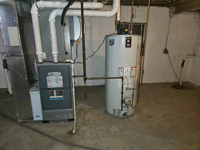 a view of a lake and green valley