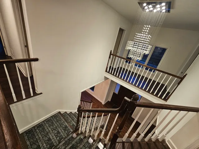 a view of an entryway with wooden floor