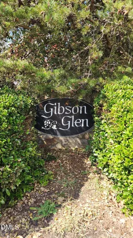 a view of outdoor space with signage and flags